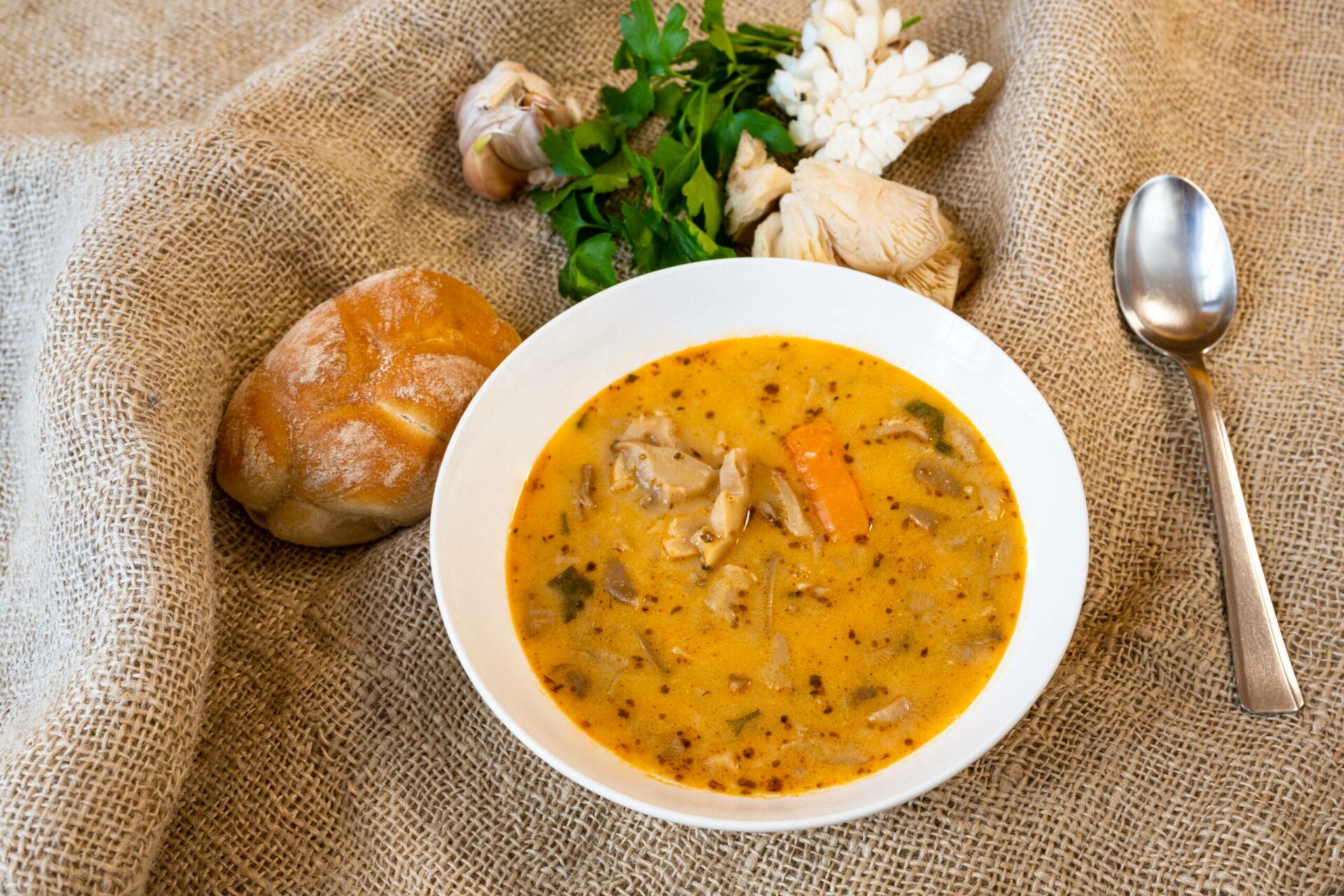 Smaki na boczniaki - Healthy oyster mushroom soup on jute background.